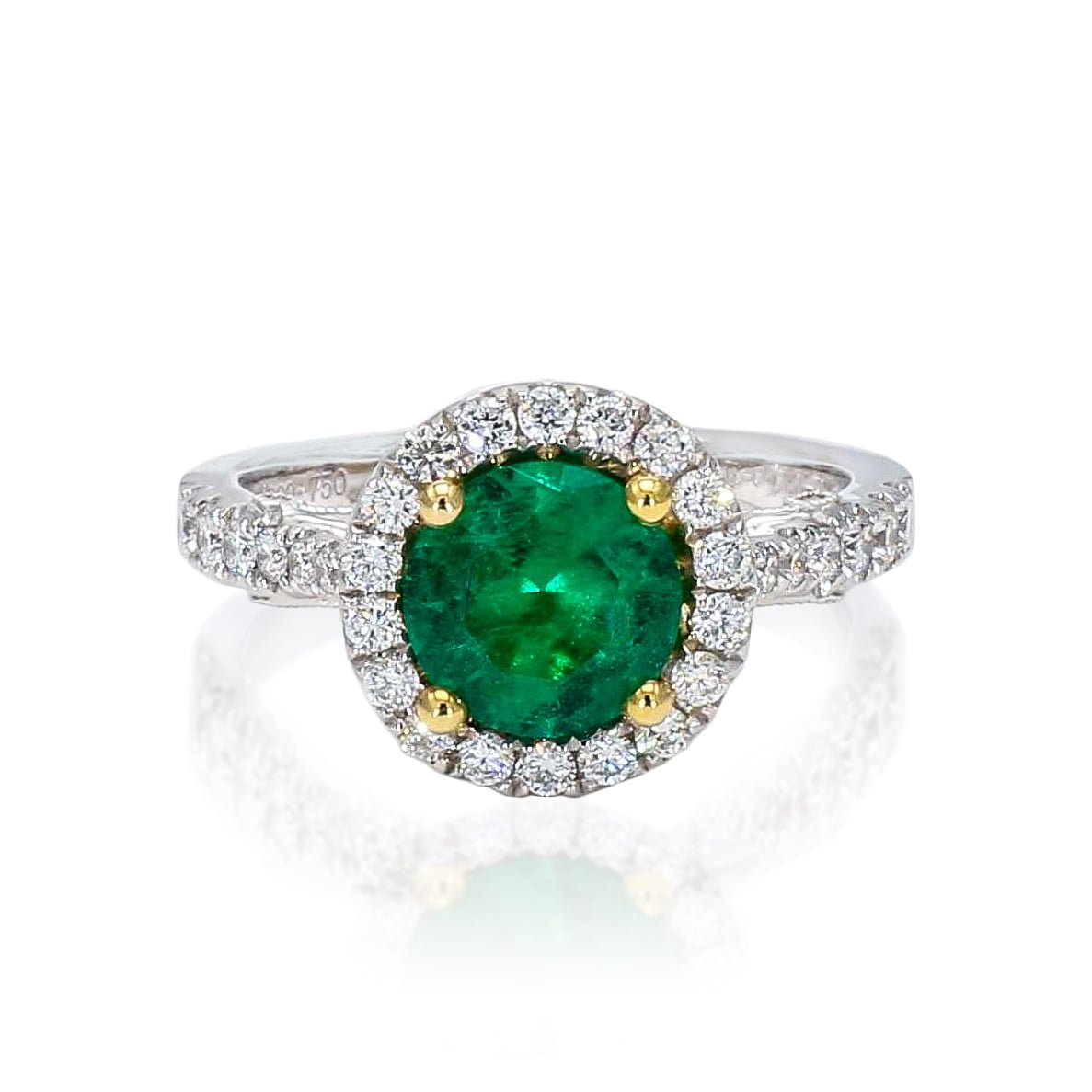 round emerald and diamond ring