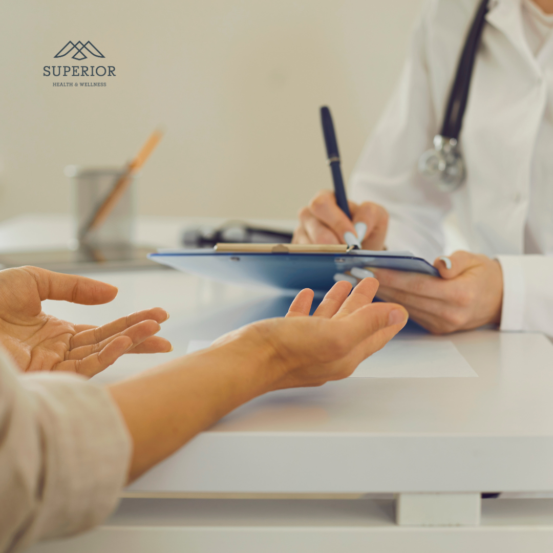 medical provider charting patient concerns in consultation