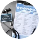 A service receipt or invoice with a pen and a keychain nearby