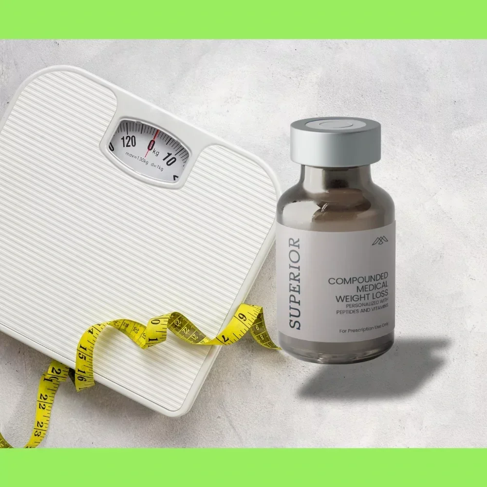 A digital bathroom scale, a bottle of superior compounded medical weight loss pills, and a yellow measuring tape on a light-colored surface.