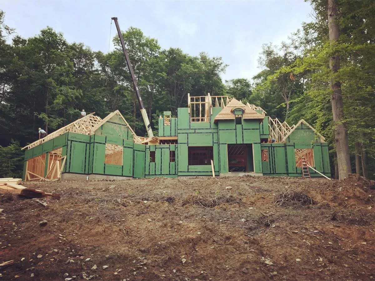 Custom home under construction on a wooded lot in Northeast Ohio