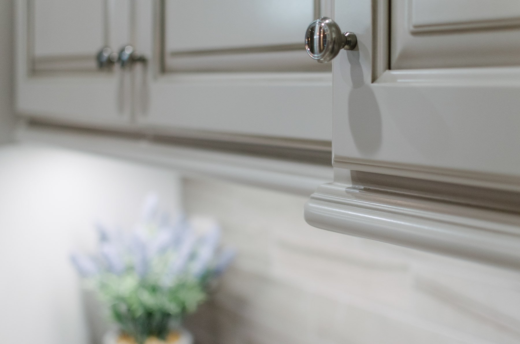 Close up of kitchen custom cabinet uppers