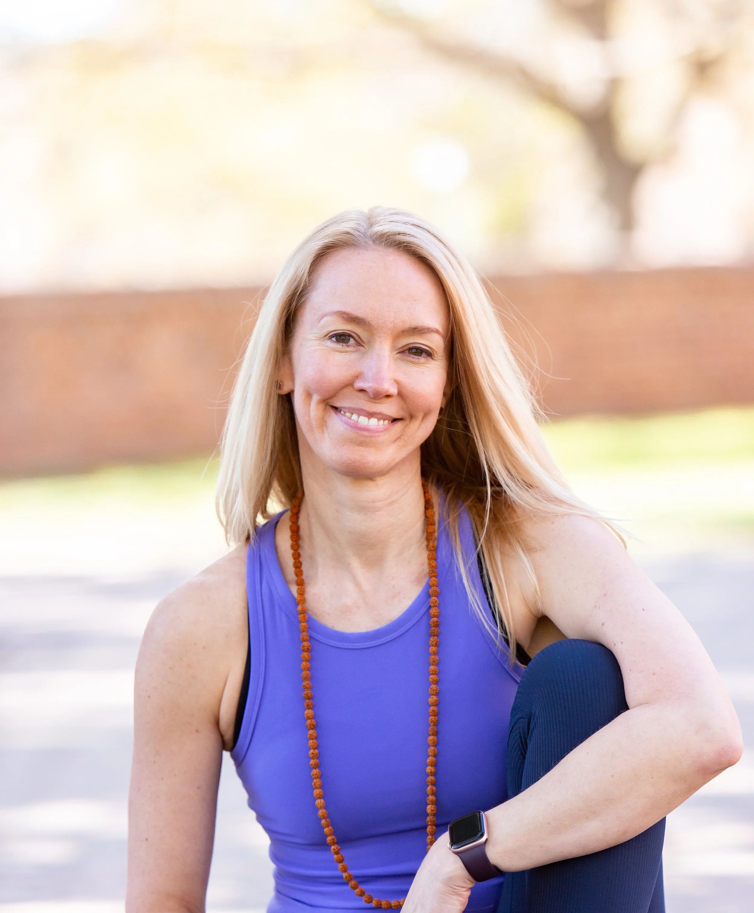 SmartFLOW Certified Teacher Trainer Jessica Ruff, smiling in a purple shirt. 