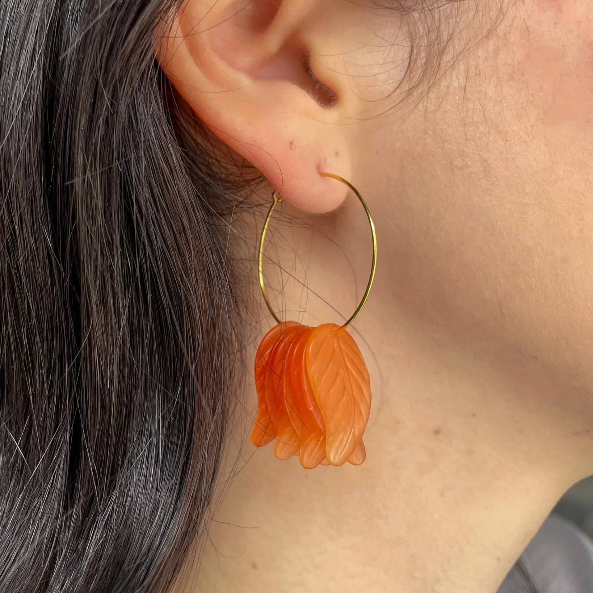 Orange glass leaves gold hoop earrings wearing.jpeg