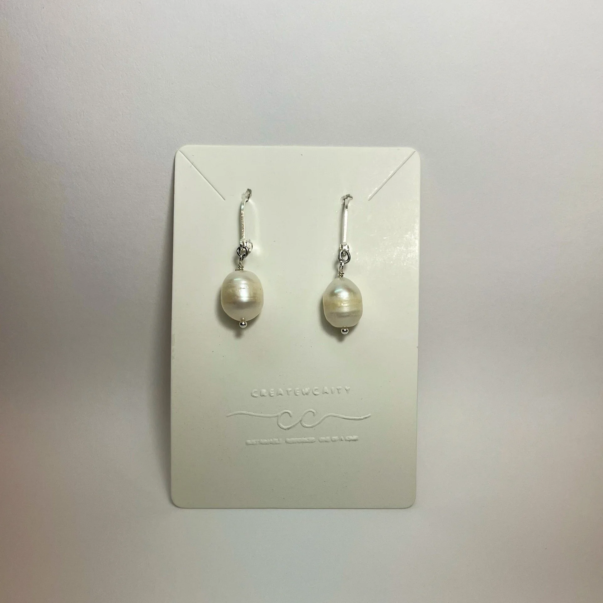 Pearl dangle earrings staged 1.jpeg