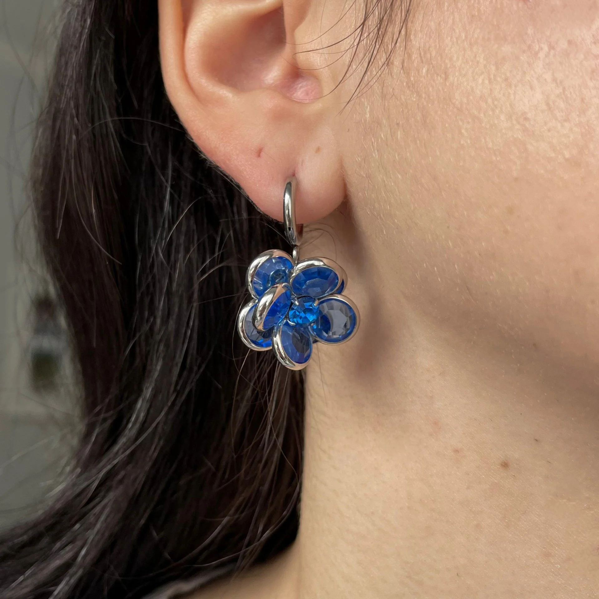 Blue flower earrings wearing.jpeg
