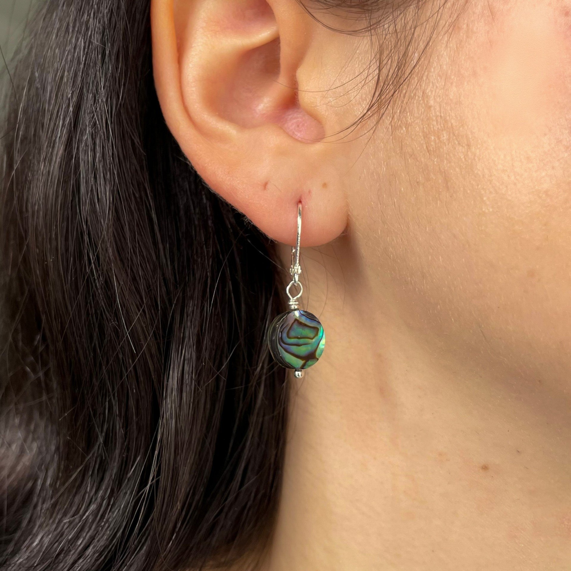 Silver and Abolone circle earrings wearing.jpeg