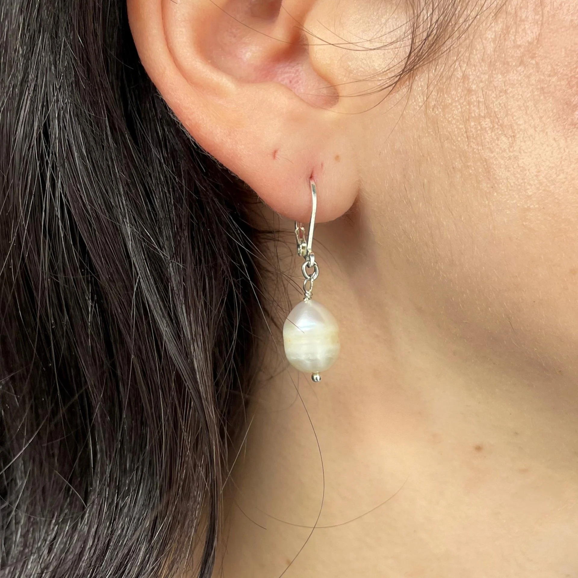 Pearl dangle earrings wearing.jpeg