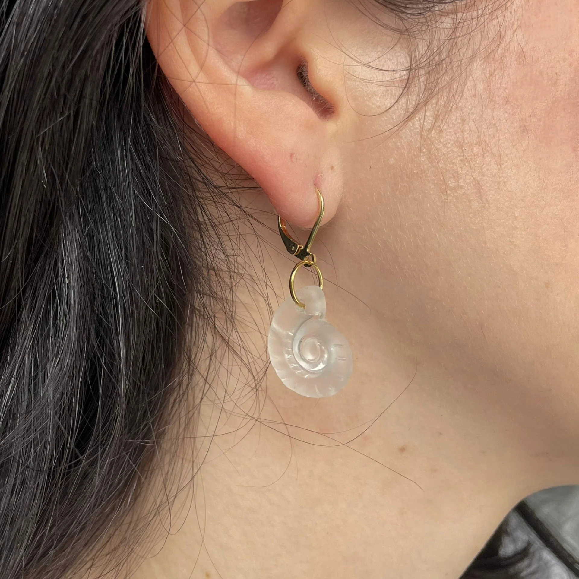 Glass swirl and gold earrings wearing.jpeg