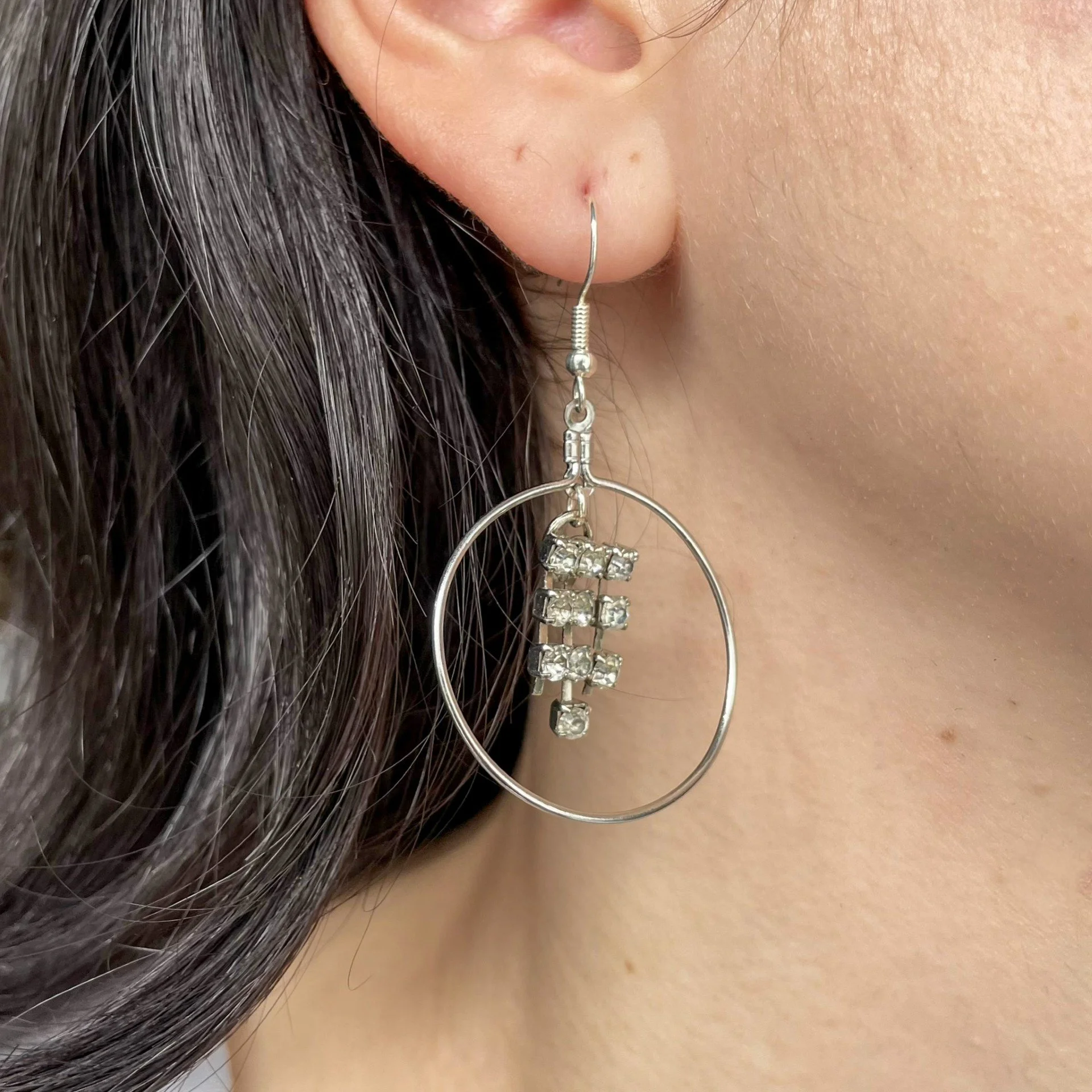 Hoop and crystal silver earrings wearing.jpeg