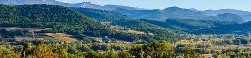 Scenic landscape of French South with mountain range and lush green forest