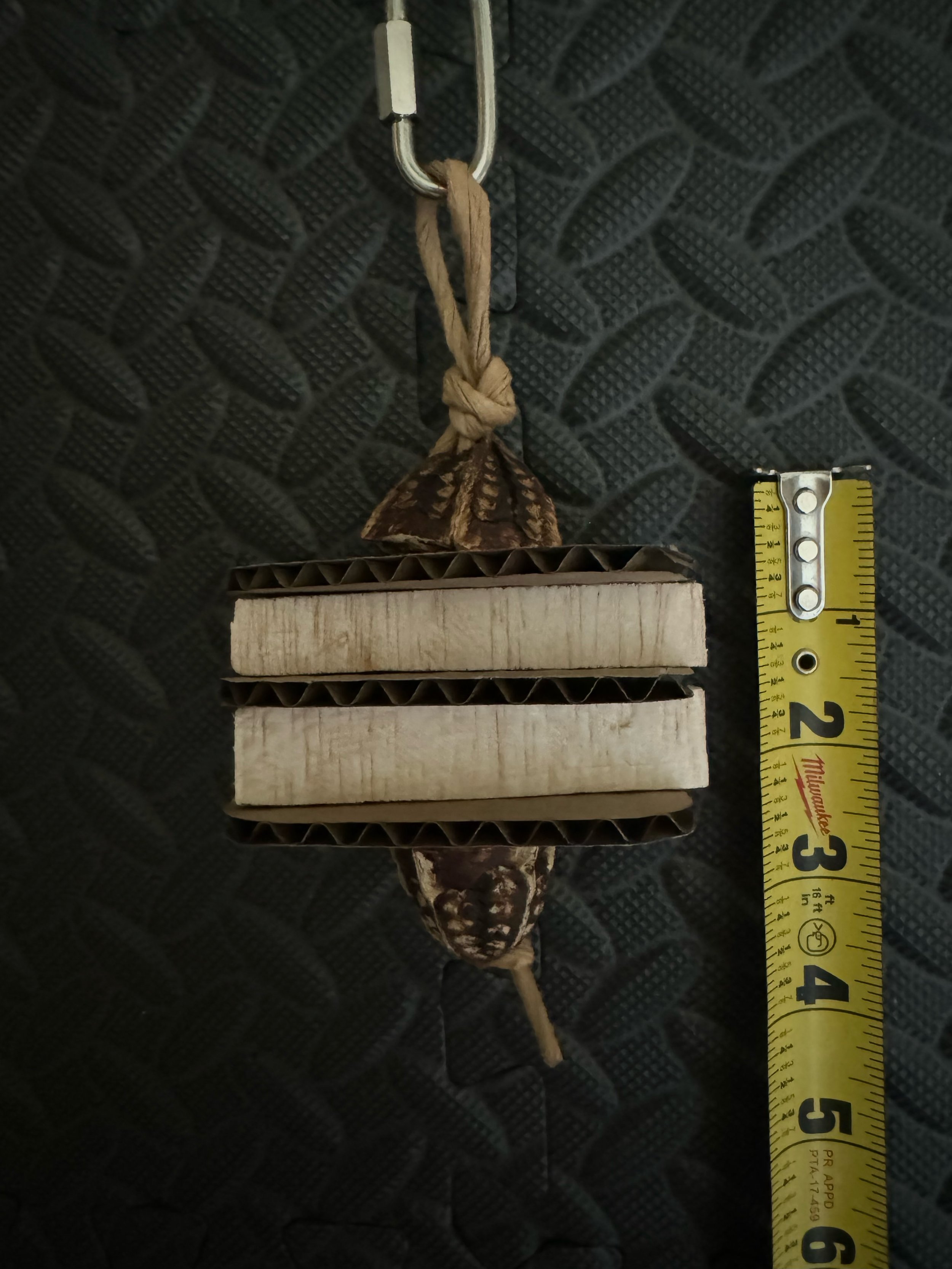 small natural bird toy made of balsa wood and cardboard