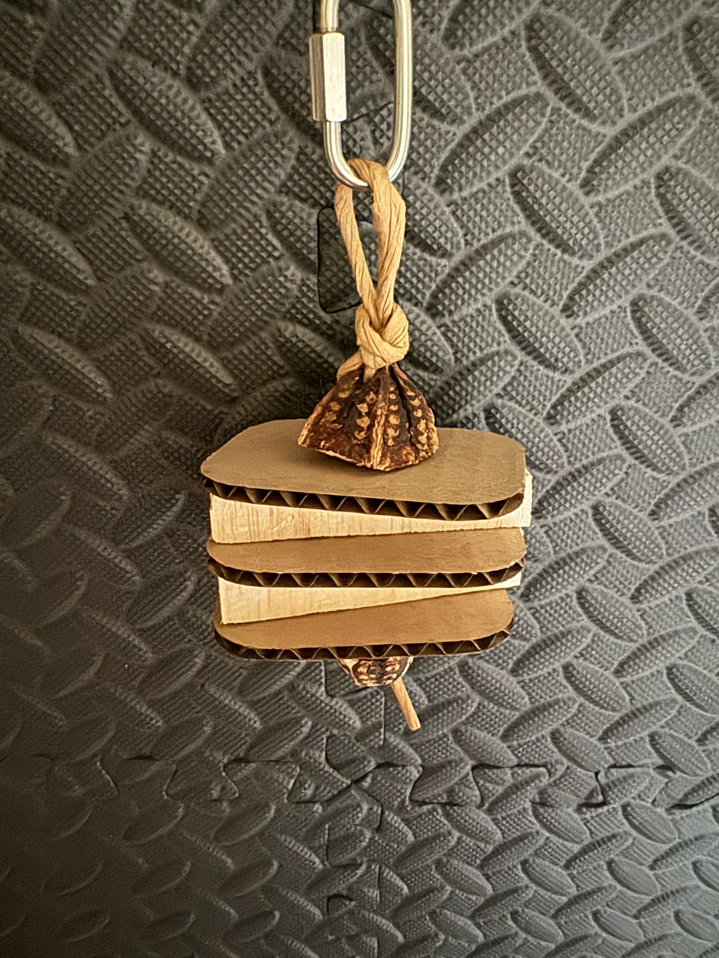 small natural bird toy made of balsa wood and cardboard