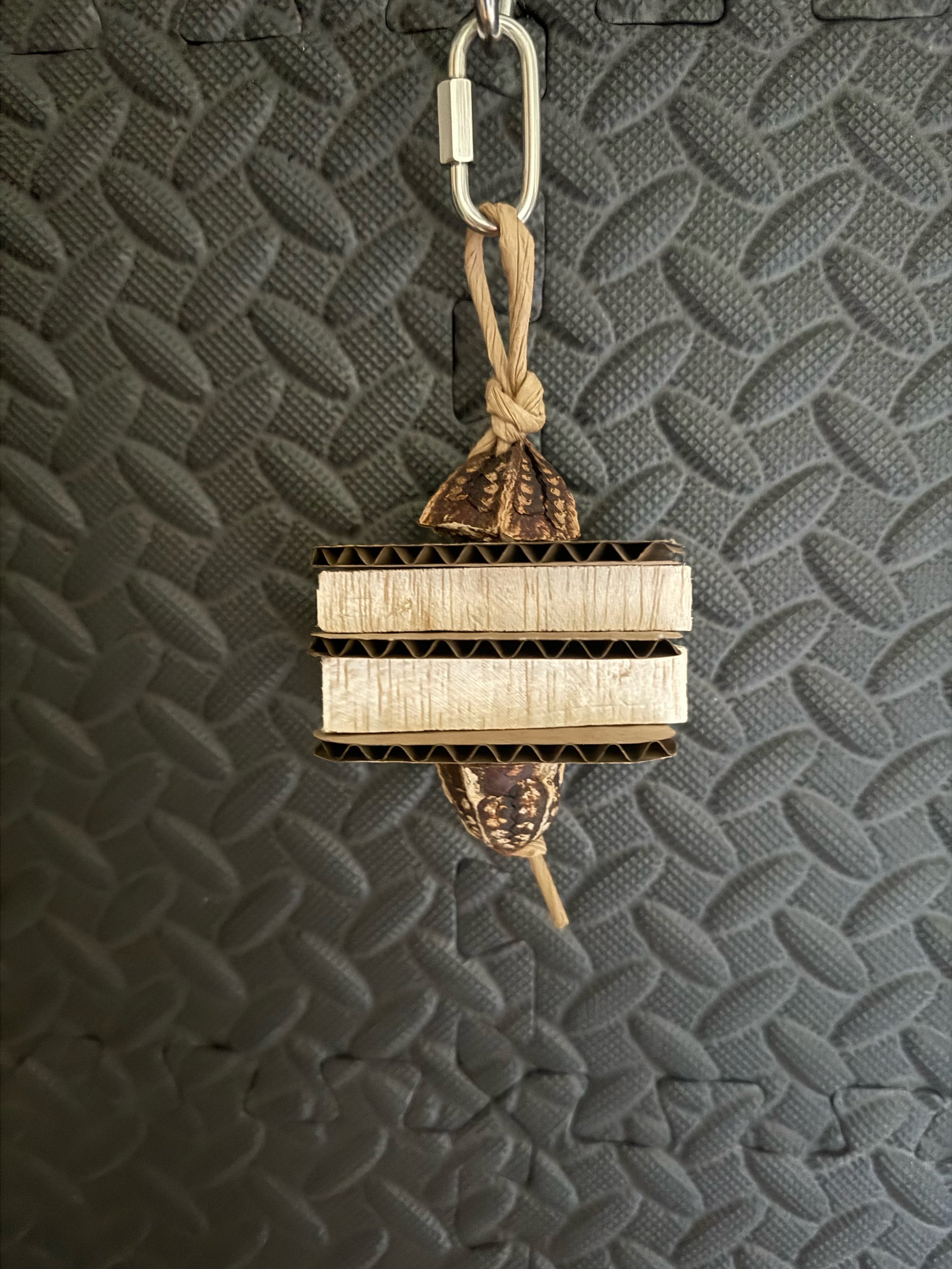 small natural bird toy made of balsa wood and cardboard