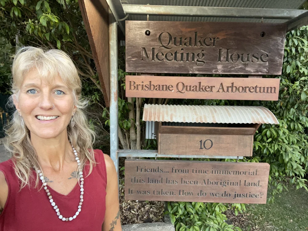 Zola next to Quaker sign.JPG