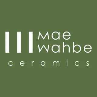 Logo for Mae Wahbe Ceramics. It is a green logo with just text saying the name.