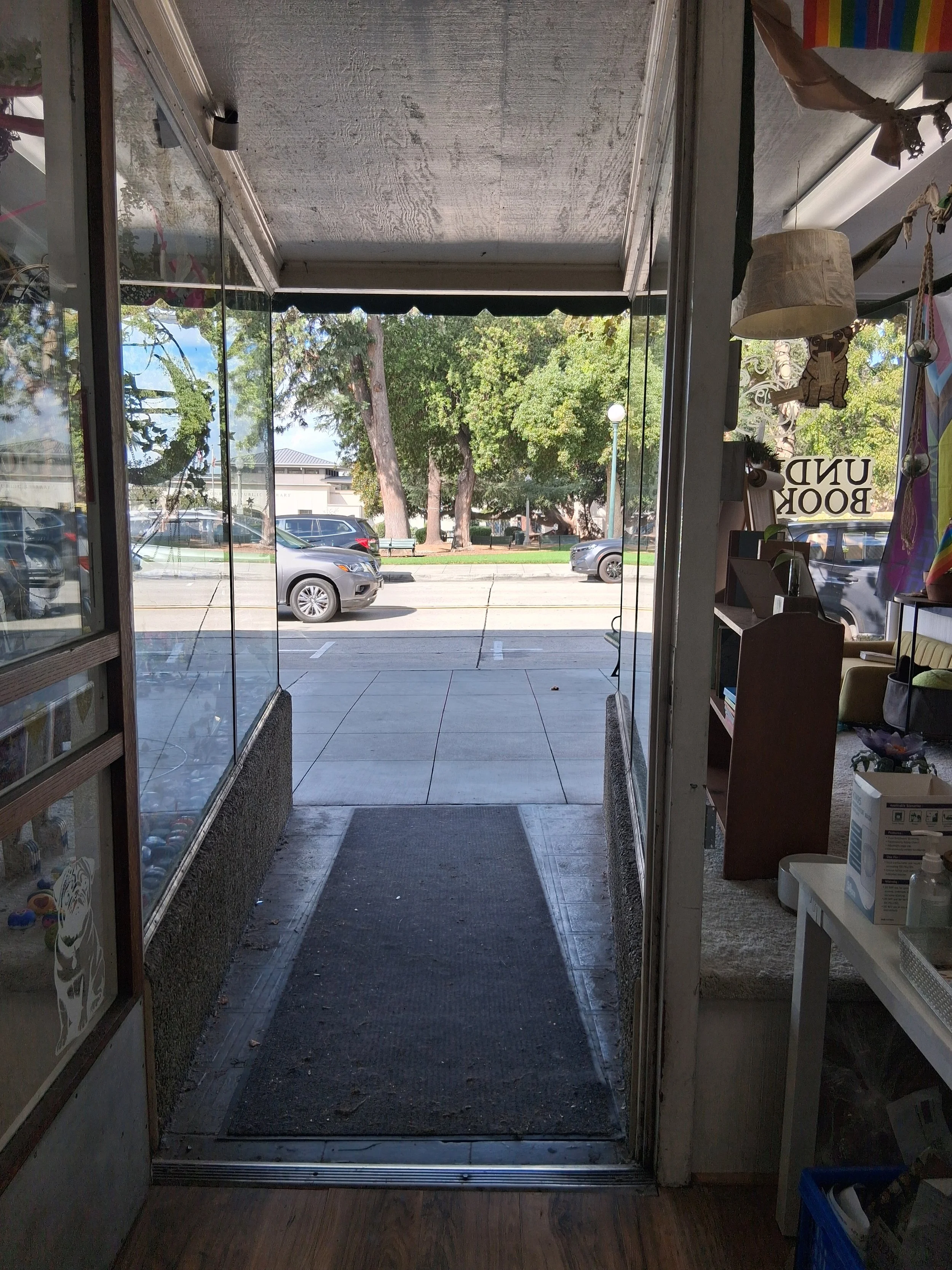 A picture of the front door of the store, showcasing the slight incline and ramp accessibility