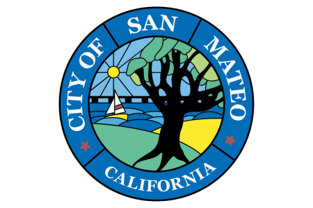 Seal of the City of San Mateo, California featuring a tree, a sailboat, a sun, and water, with the city's name encircling it.