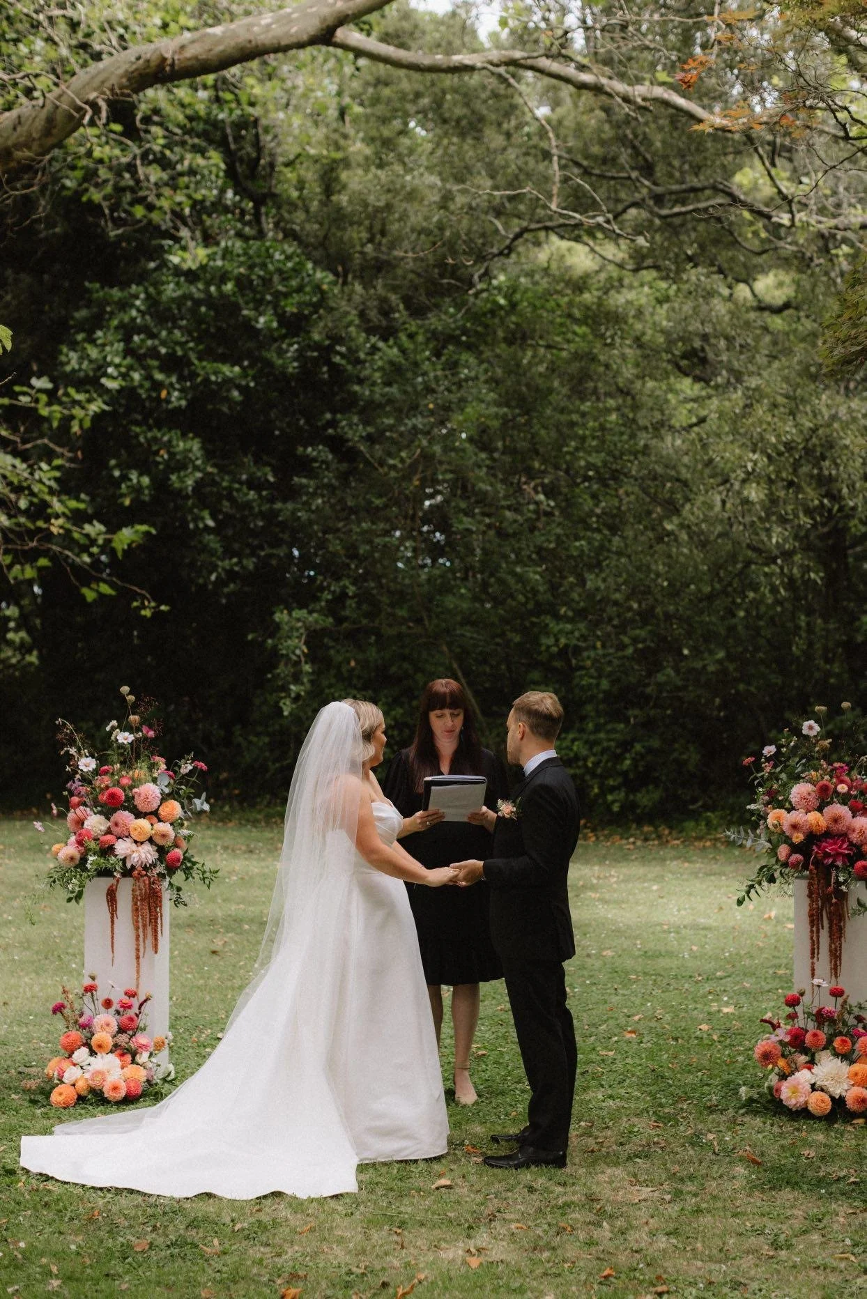 Laurie’s customers, Fernando and Kate embracing by the lake on their wedding day.