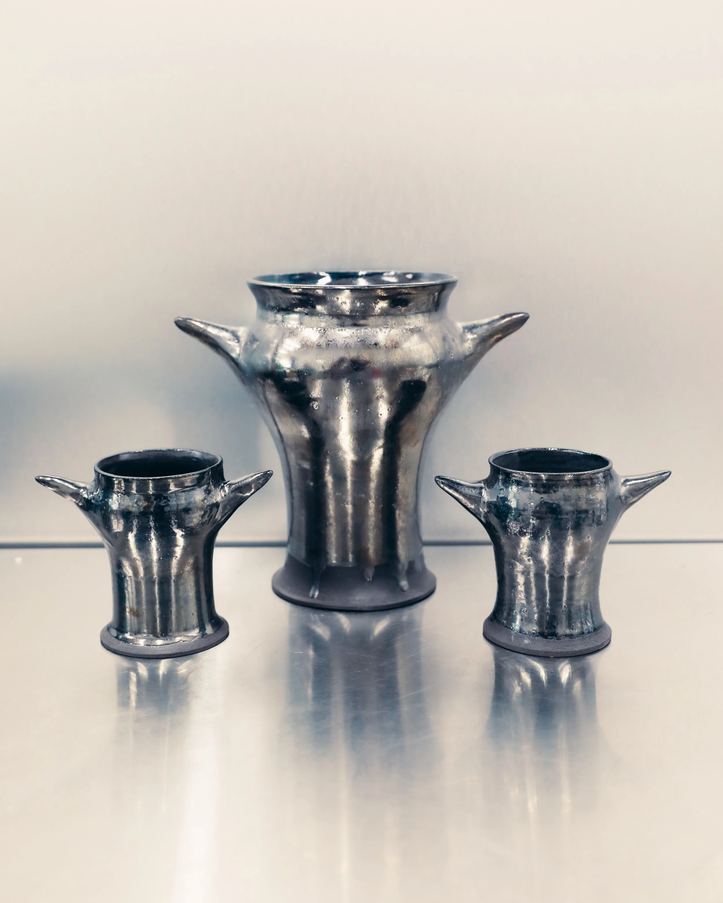 Set of metallic vases