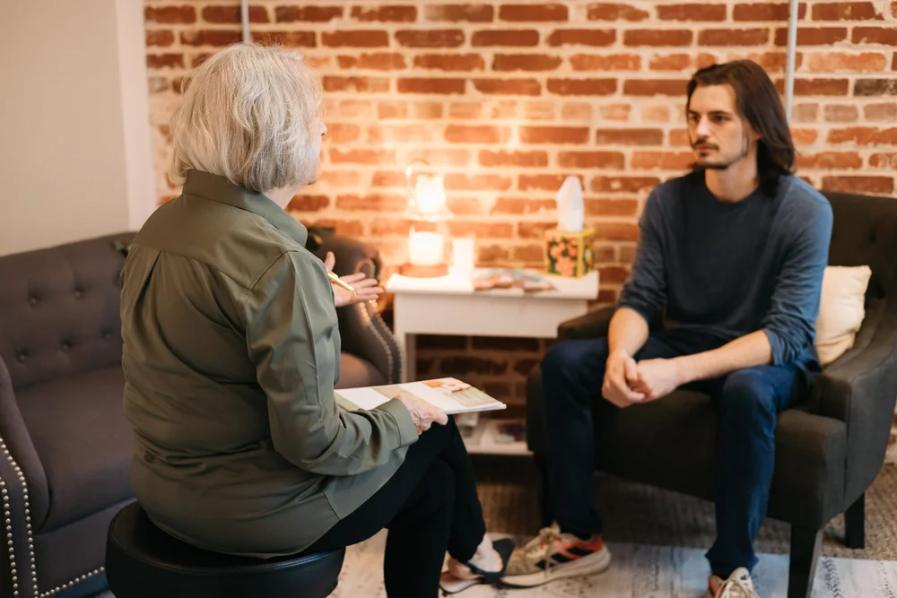 Therapist treating a male patient