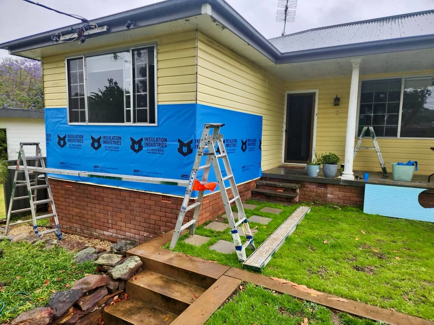 Prepping for a fresh new look! We&rsquo;re wrapping up the walls with @insulation_industries wall wrap to create a solid foundation before adding the @orangeboardau and render. This crucial step helps keep the elements out while enhancing energy effi