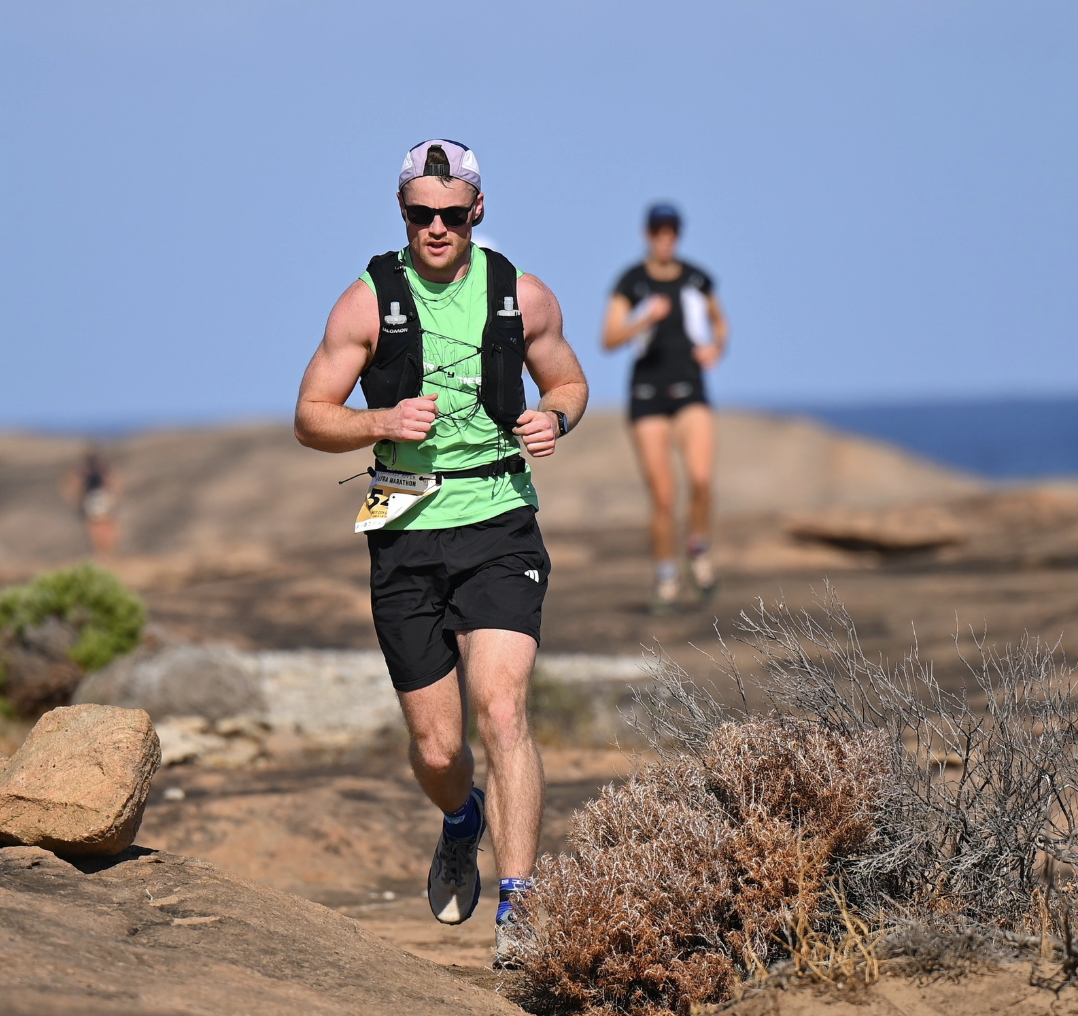 Man doing a trail run, focusing on his heart rate