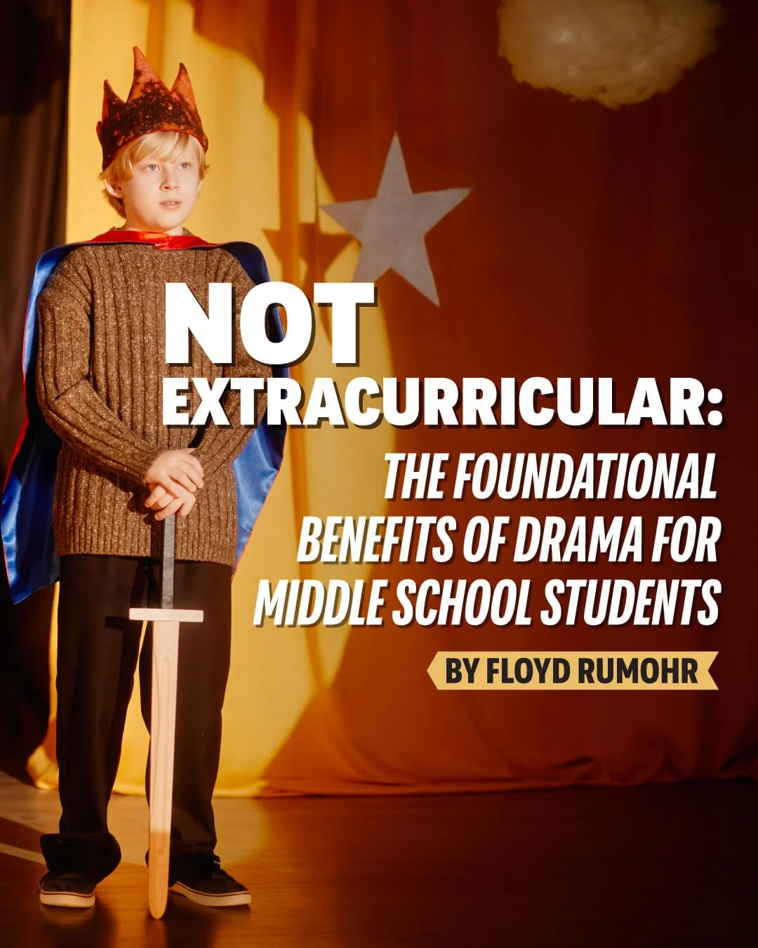 A young boy dressed as a king with a crown and cape, standing on stage with a toy sword, in front of a yellow curtain with a star decoration, during a school play or event.