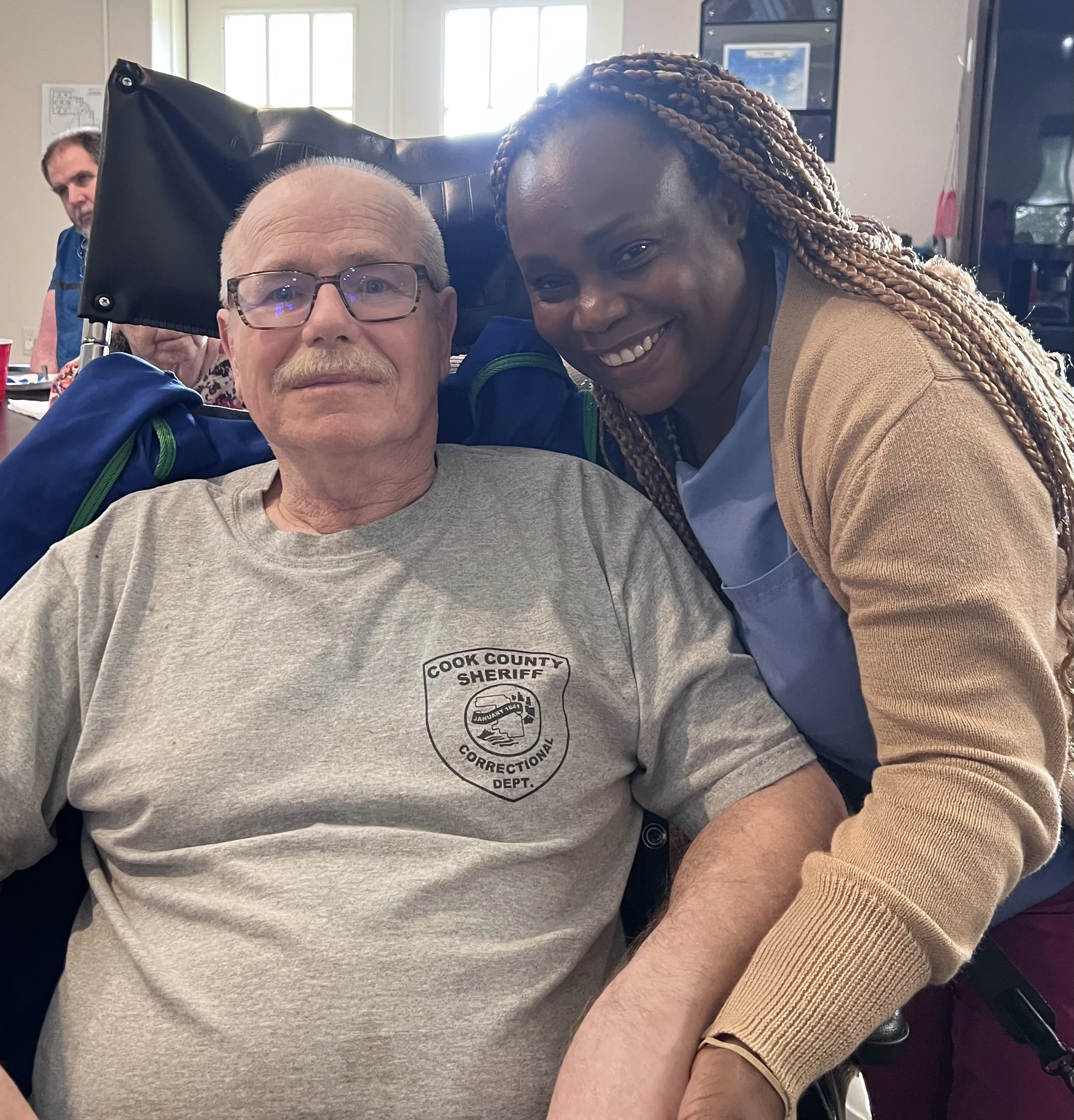 A smiling Fountainhead Homes resident with a staff member