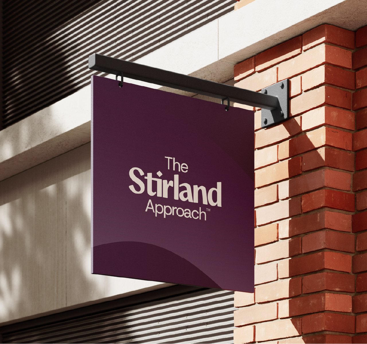 The Stirland Approach logo on a wall sign attached to a wall, shop signage