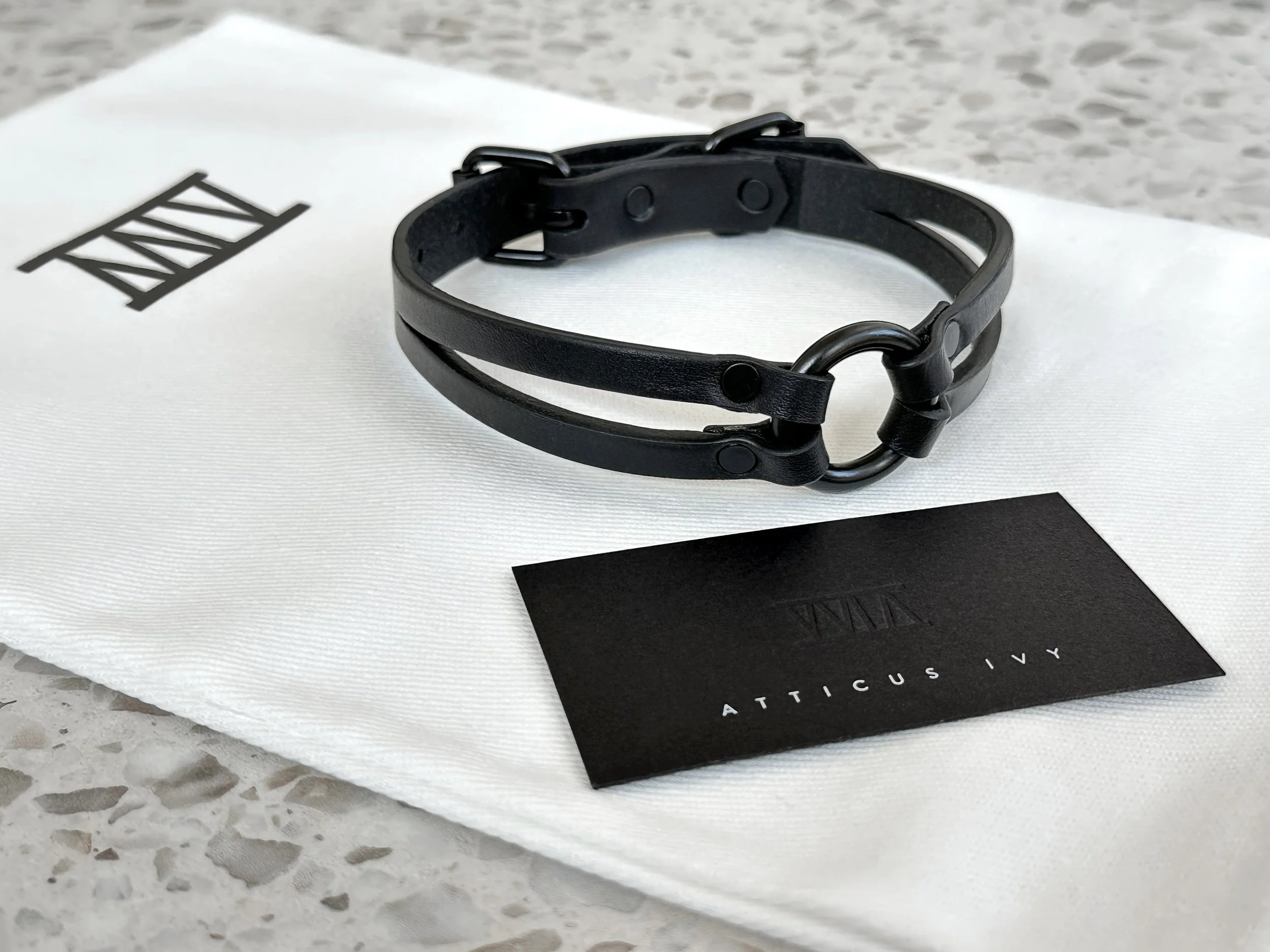 Atticus Ivy Oska slim black on black leather split strap collar_on bag.jpg