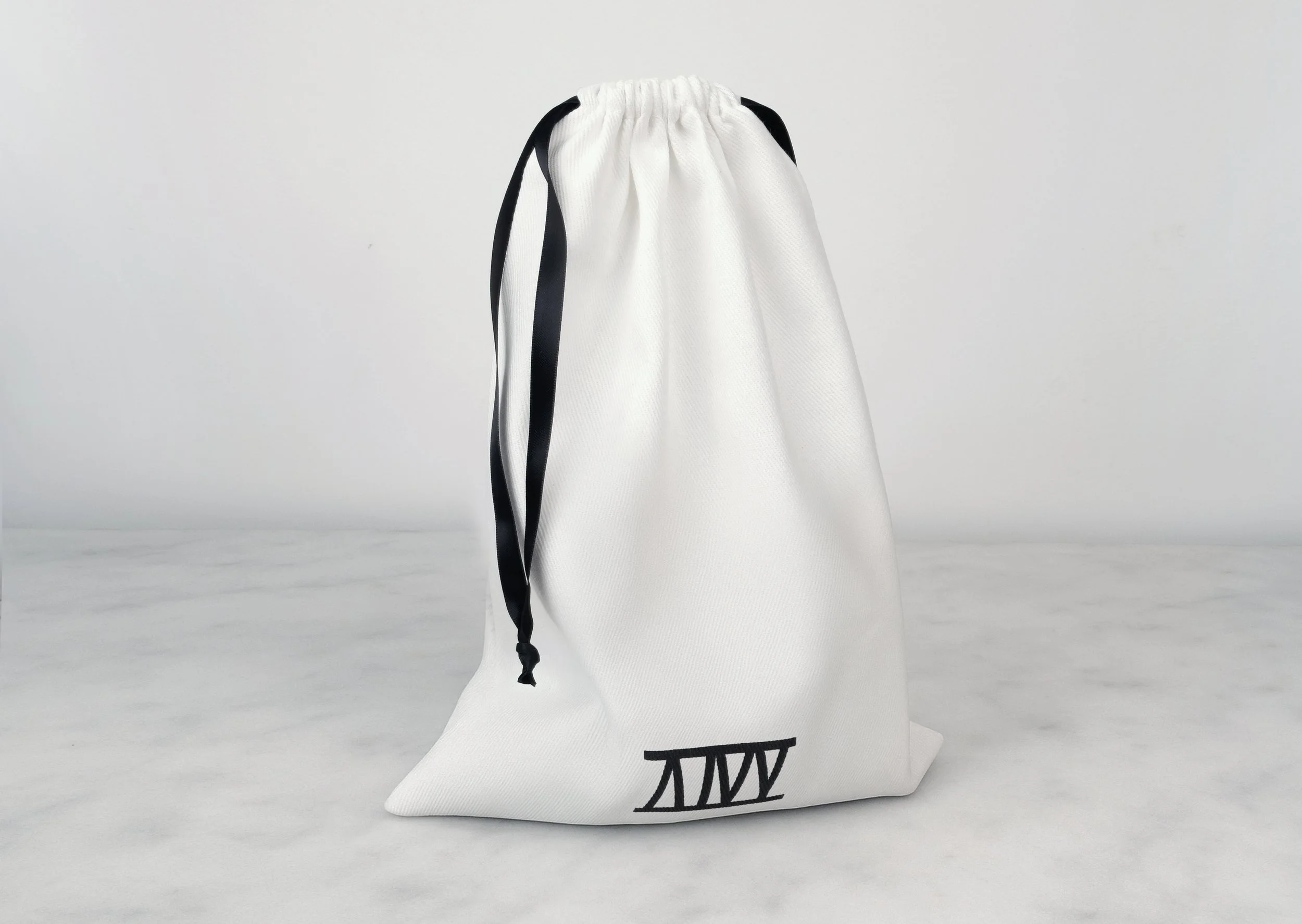 Atticus Ivy Haika cuffs in black saddlery with stainless steel hardware_bag.jpg