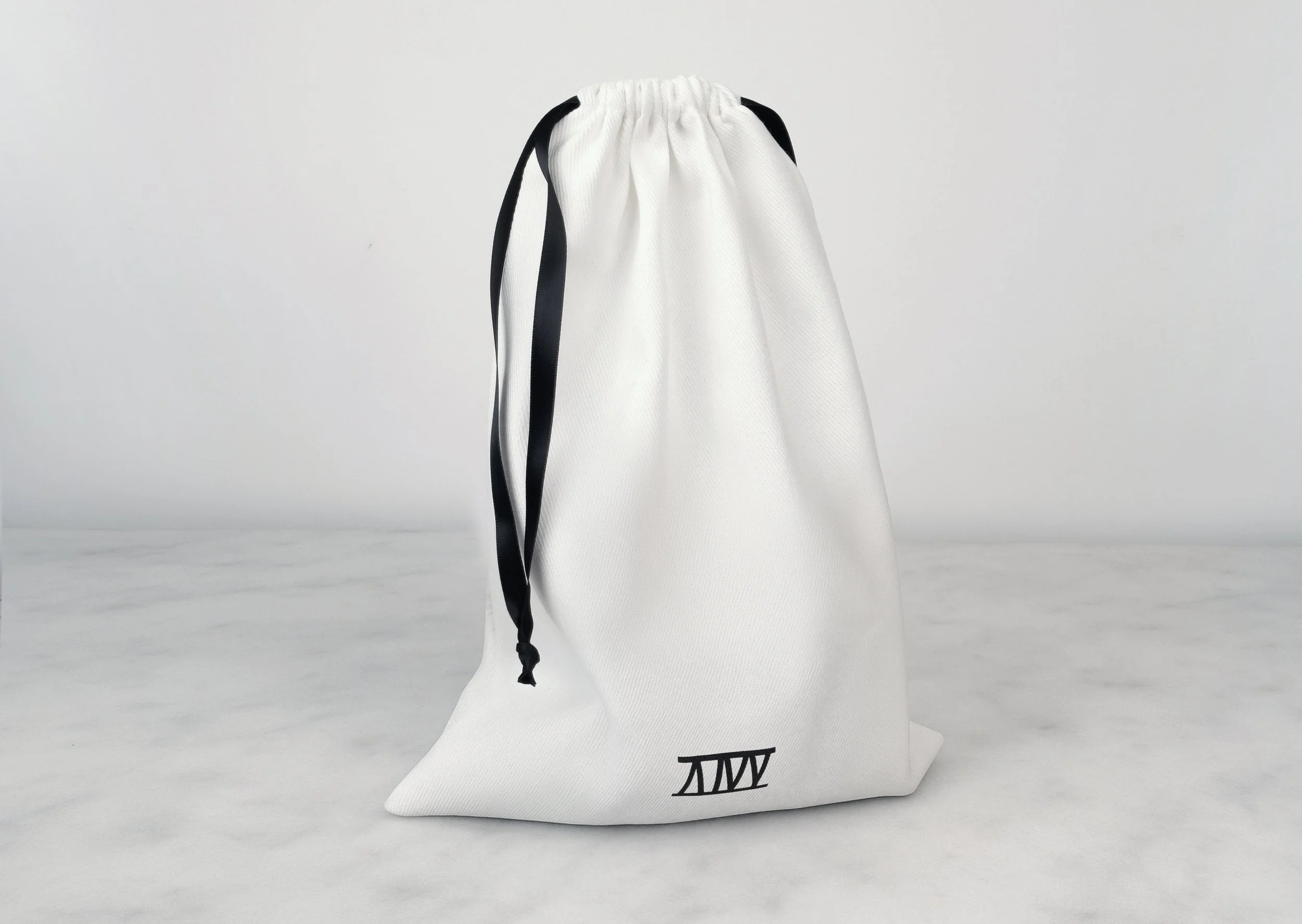Atticus Ivy Rea collar in black leather with stainless steel_bag up.jpg