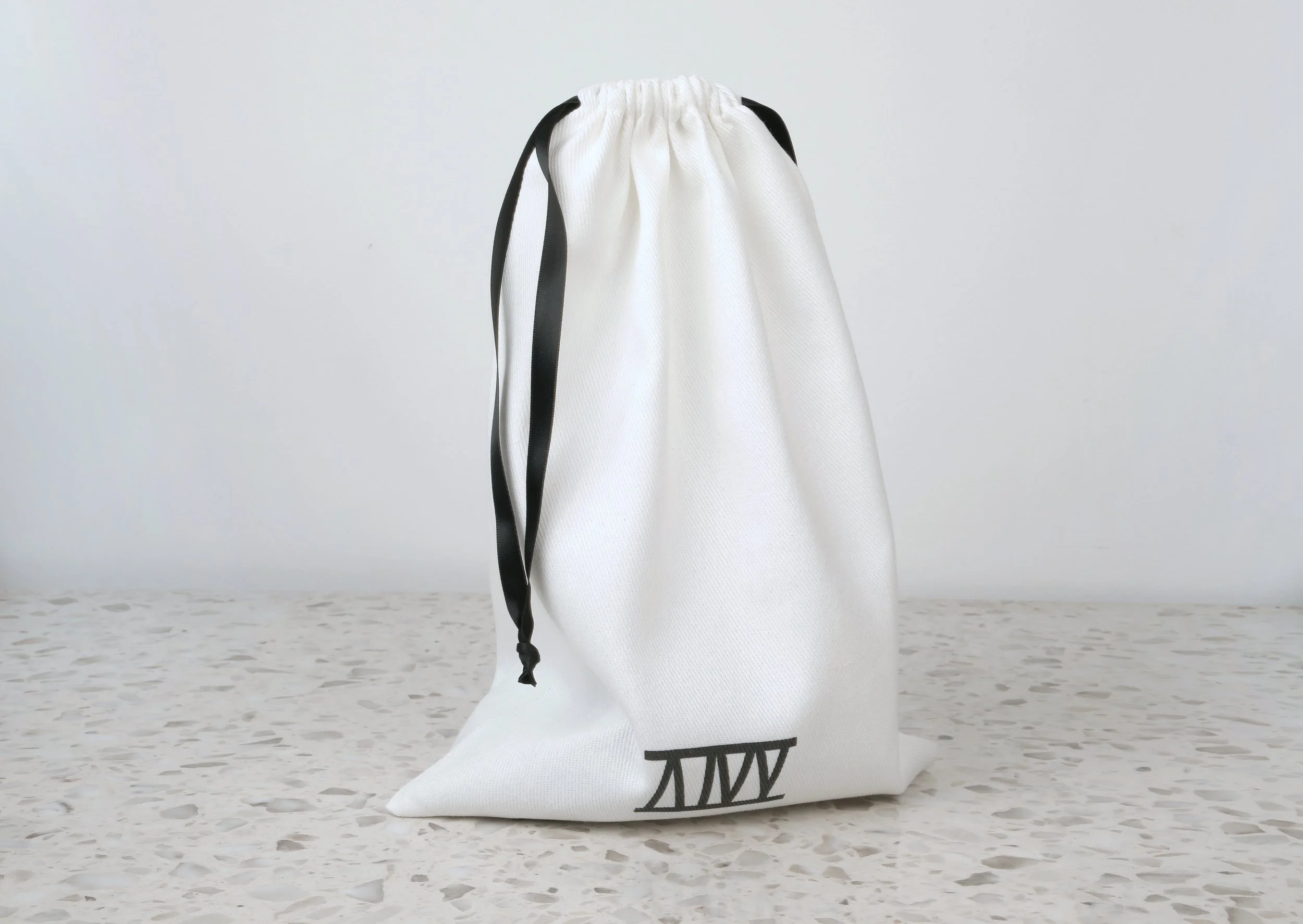 Atticus Ivy Teyr collar in black saddlery with solid brass hardware_bag.jpg
