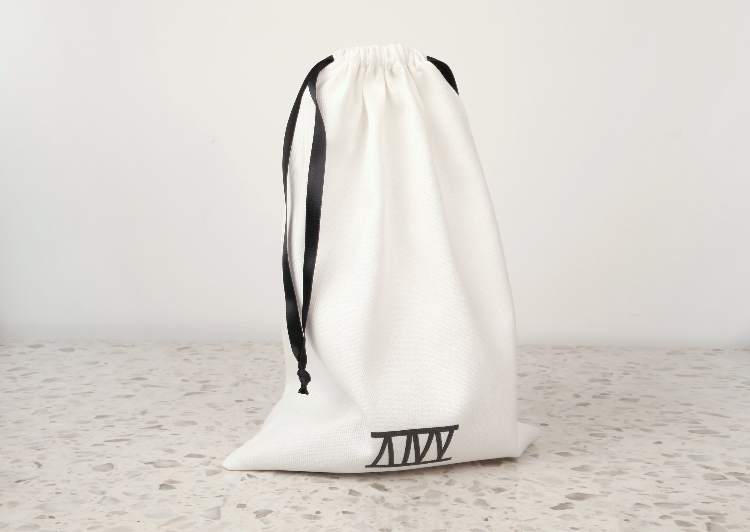 Atticus Ivy Teyr collar in black saddlery with solid brass hardware_bag.jpg