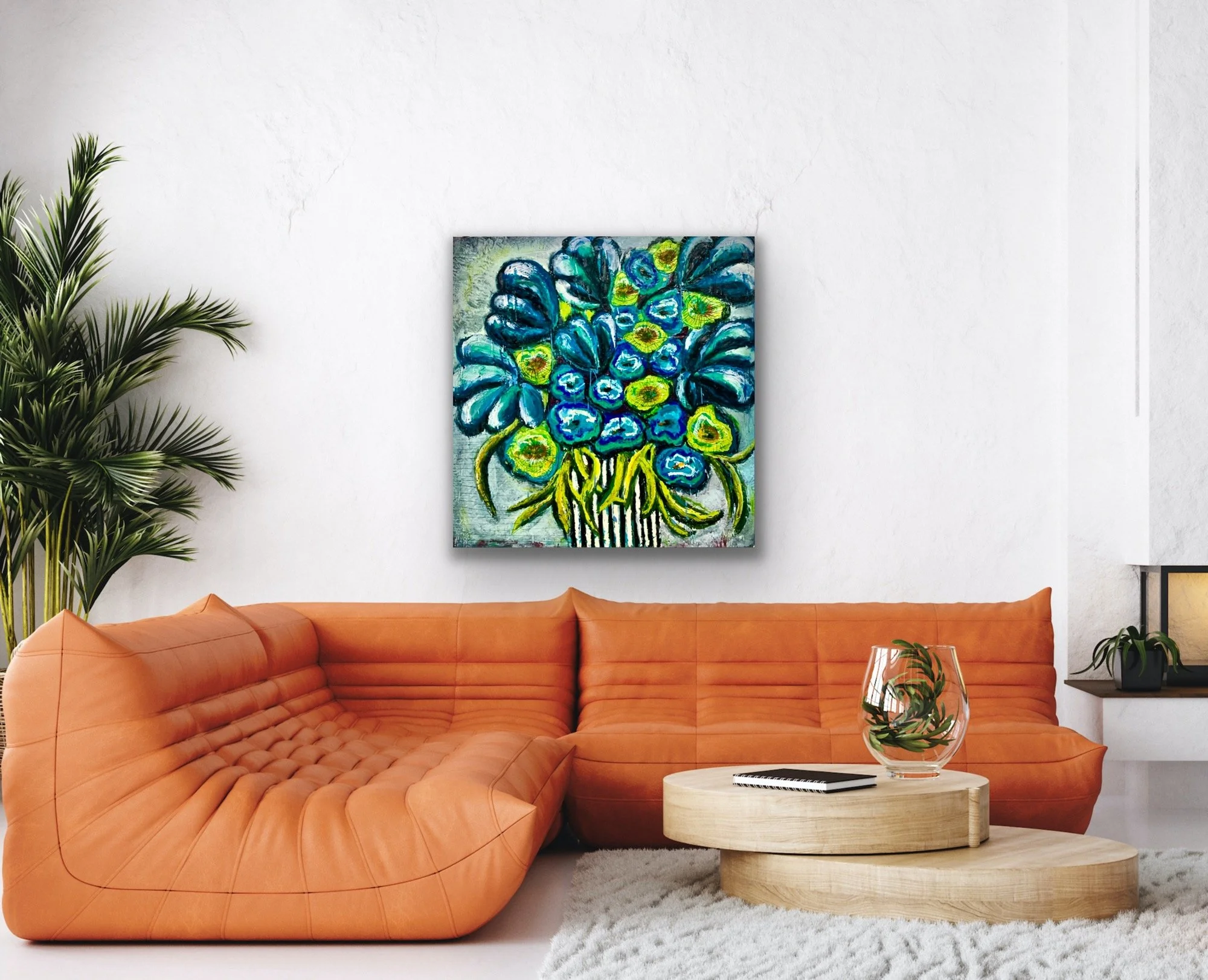 Original encaustic floral painting by Emily Scott in blue and yellow, styled above an orange sectional sofa for fine art consulting clients