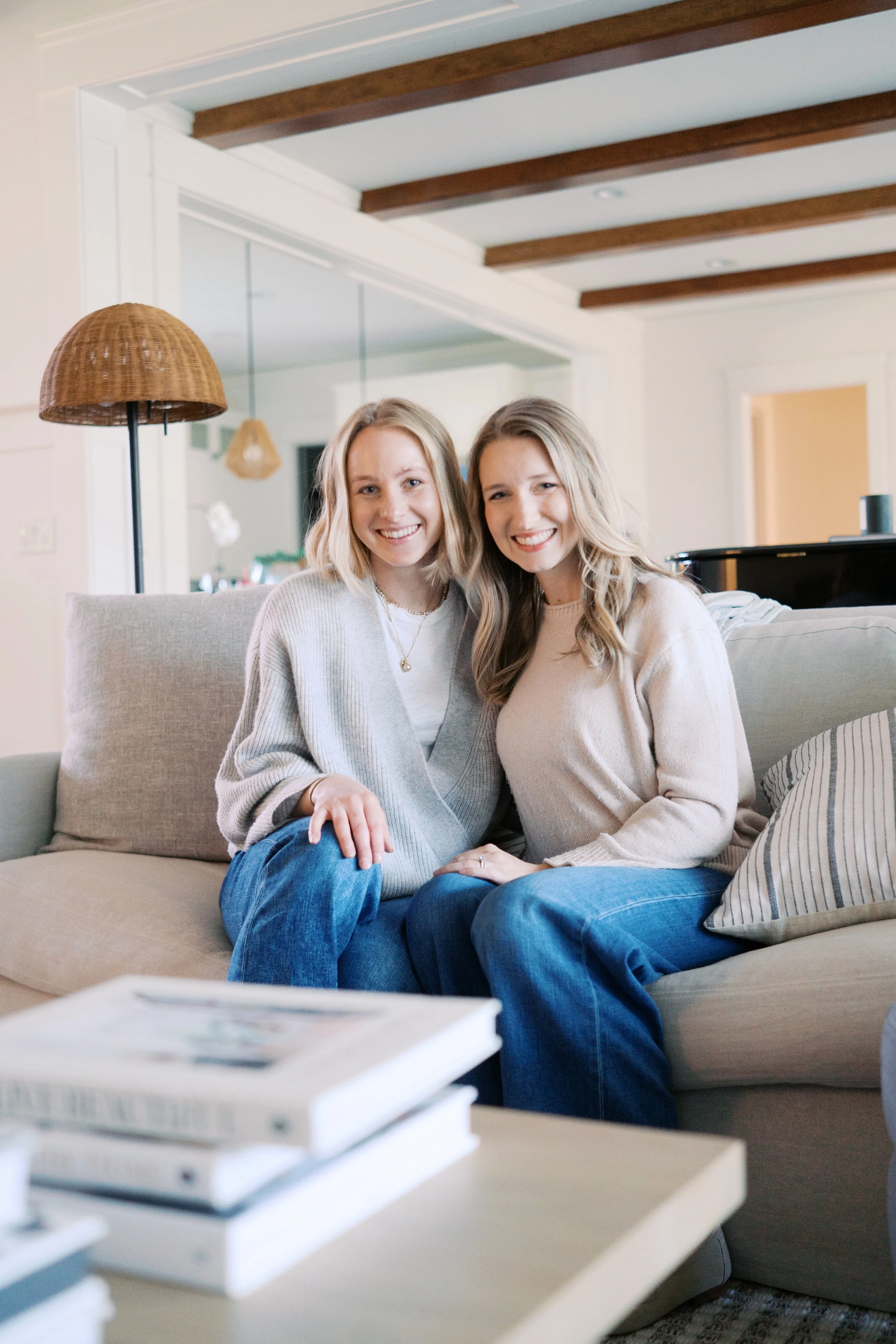 Grace and Rachel Thweatt sitting on a couch