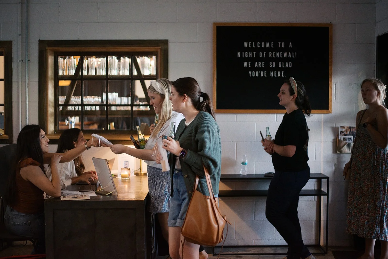 Women standing in line for an event