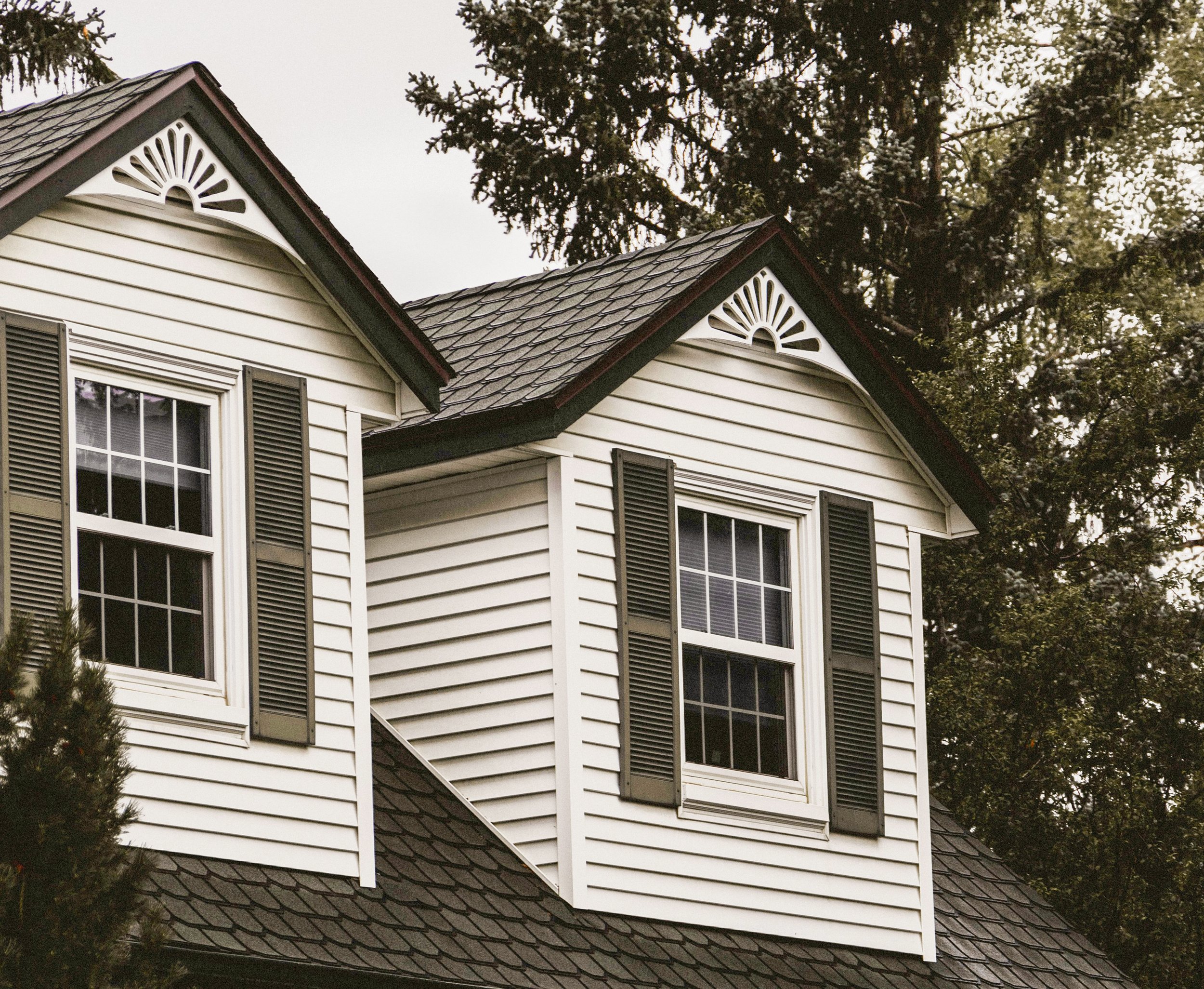 Dormer windows with black shutters