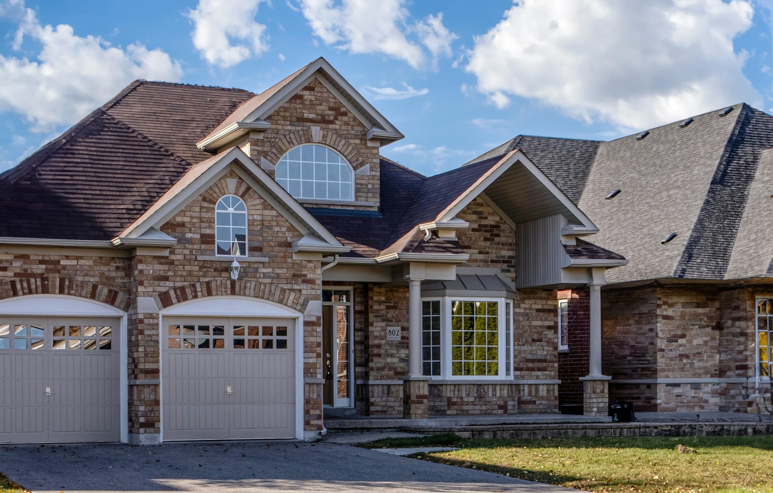 Large home with architectural roofing shingles