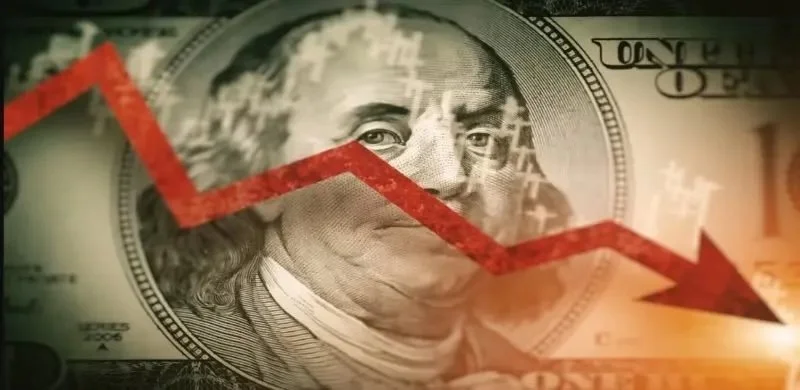 A dollar bill with Benjamin Franklin's portrait and a red downward trending arrow overlaid, indicating financial decline.