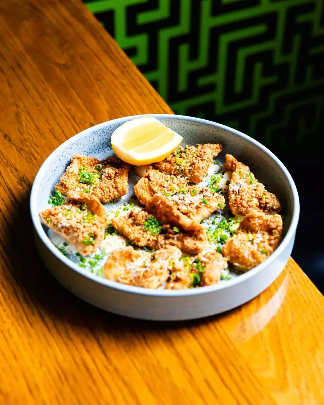 Crispy on the outside, tender on the inside. ✨ Our Coconut Calamari is a study in textures. Lightly fried with coconut and sumac, then paired with chilled ajoblanco and a bright hit of lemon for a refined, coastal finish.