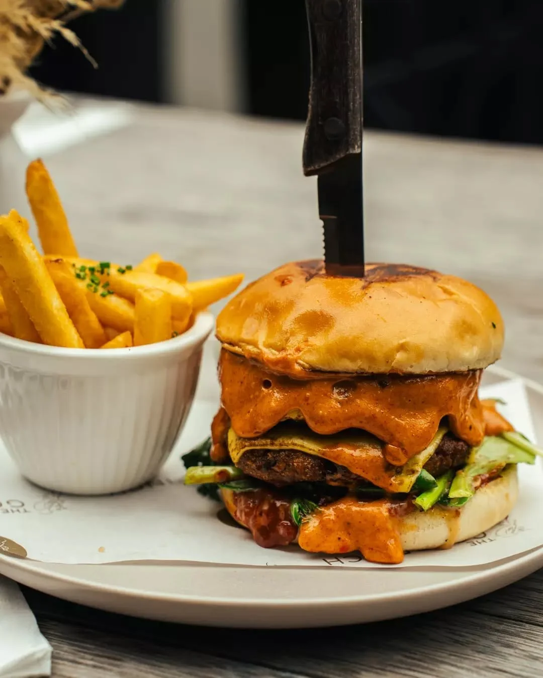 The lunch service, redefined. ✨ Our Spiced Potato &amp; Lentils burger is a masterclass in texture. A crispy vegetarian patty layered with double cheese, sweet onion jam, and a sharp habanero kick. Bold, balanced, and perfectly timed for your midday 