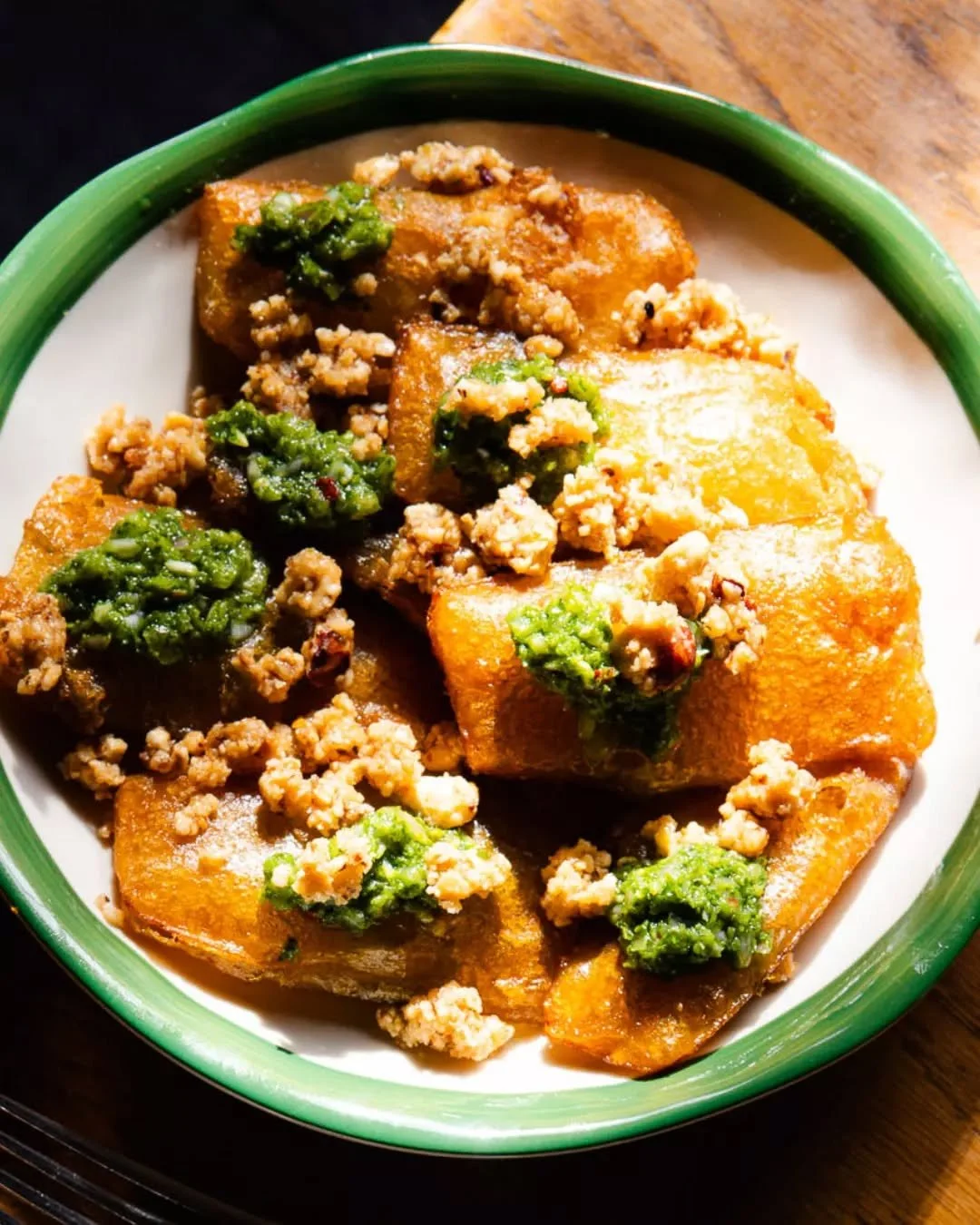 Meet your new favorite bite. Our Pumpkin Fritti is a perfect harmony of sweet and spice, featuring honey Sichuan and vibrant salsa verde. Finished with the richness of burnt butter and a satisfying hazelnut crunch, it is a dish that proves vegetables