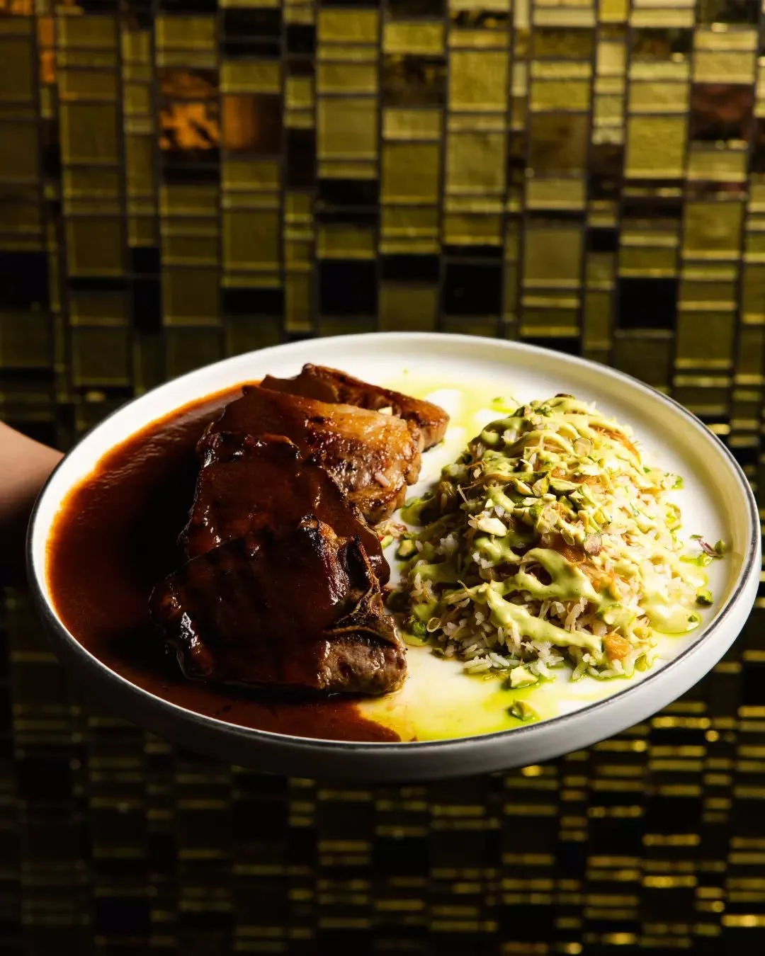 Experience the best of New Zealand with our Grilled NZ Lamb Chops. Featuring succulent glazed shoulder chops paired with the crunch of pistachio and the sweetness of raisin labneh, this dish is a masterclass in flavor. Served alongside fragrant Leban