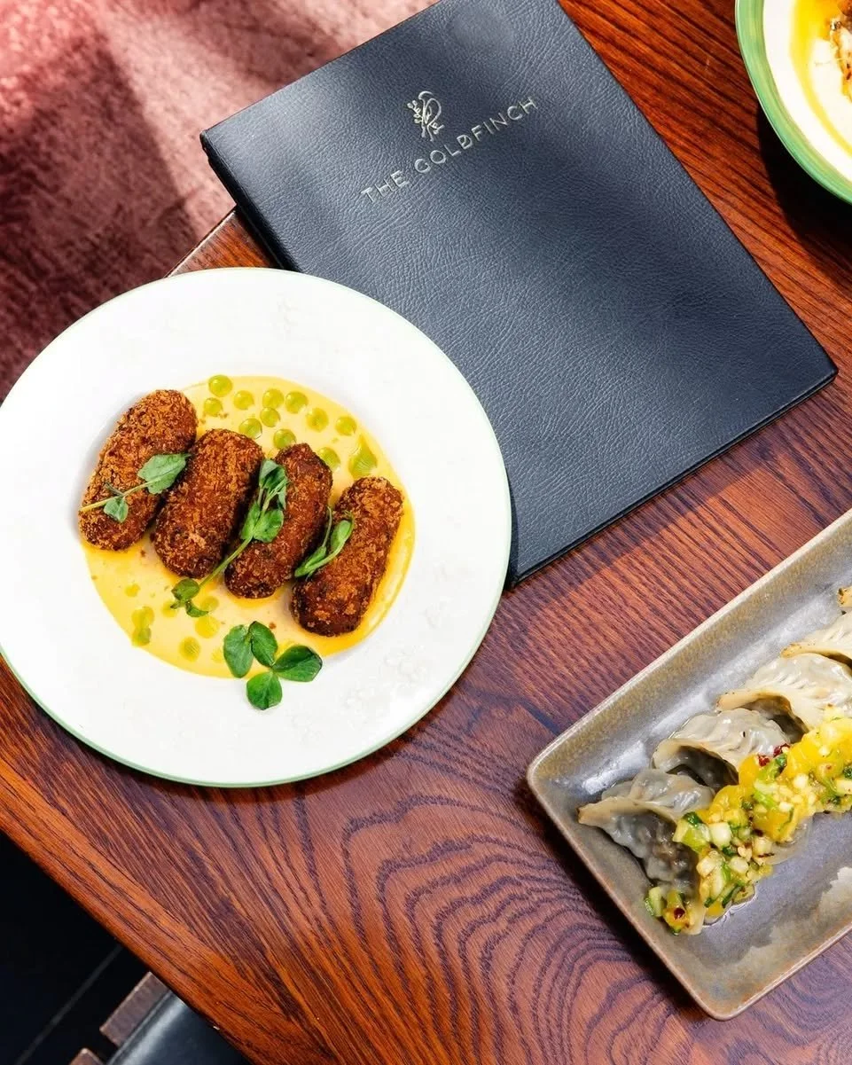Every dish at The Goldfinch tells a story of contrasting textures and bold flavours. 

Whether you're stopping by for a quick bite after work or settling in for a full culinary tour of our menu, there's always something new to discover on the table.
