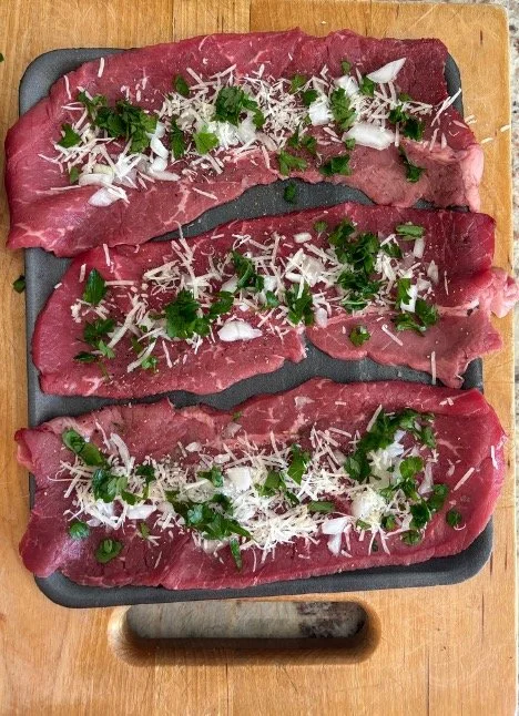 Add Onion, Salt, Pepper, Mashed Garlic,Shredded Parmesan Cheese & Parsley.