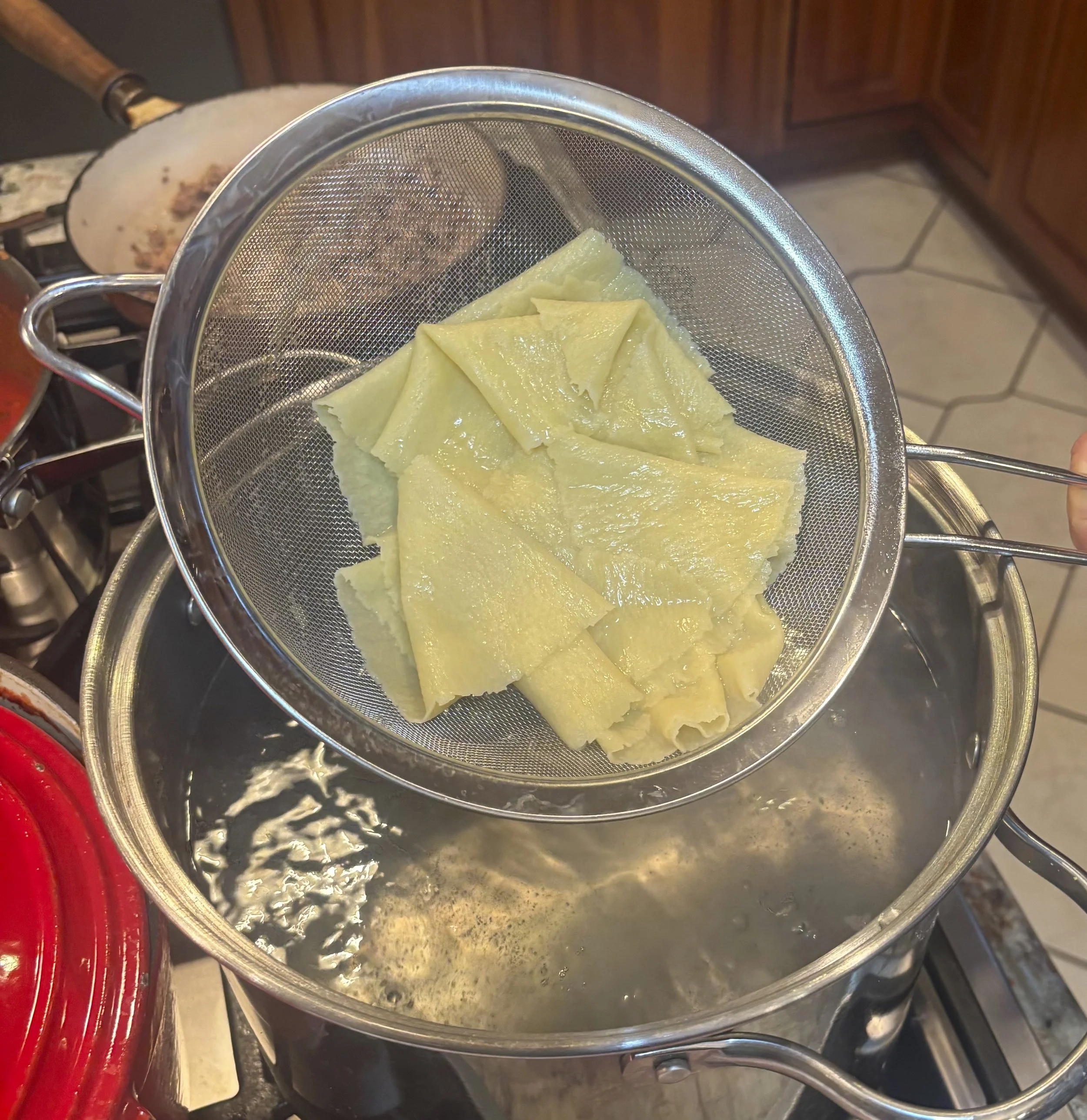 Remove pasta and drain