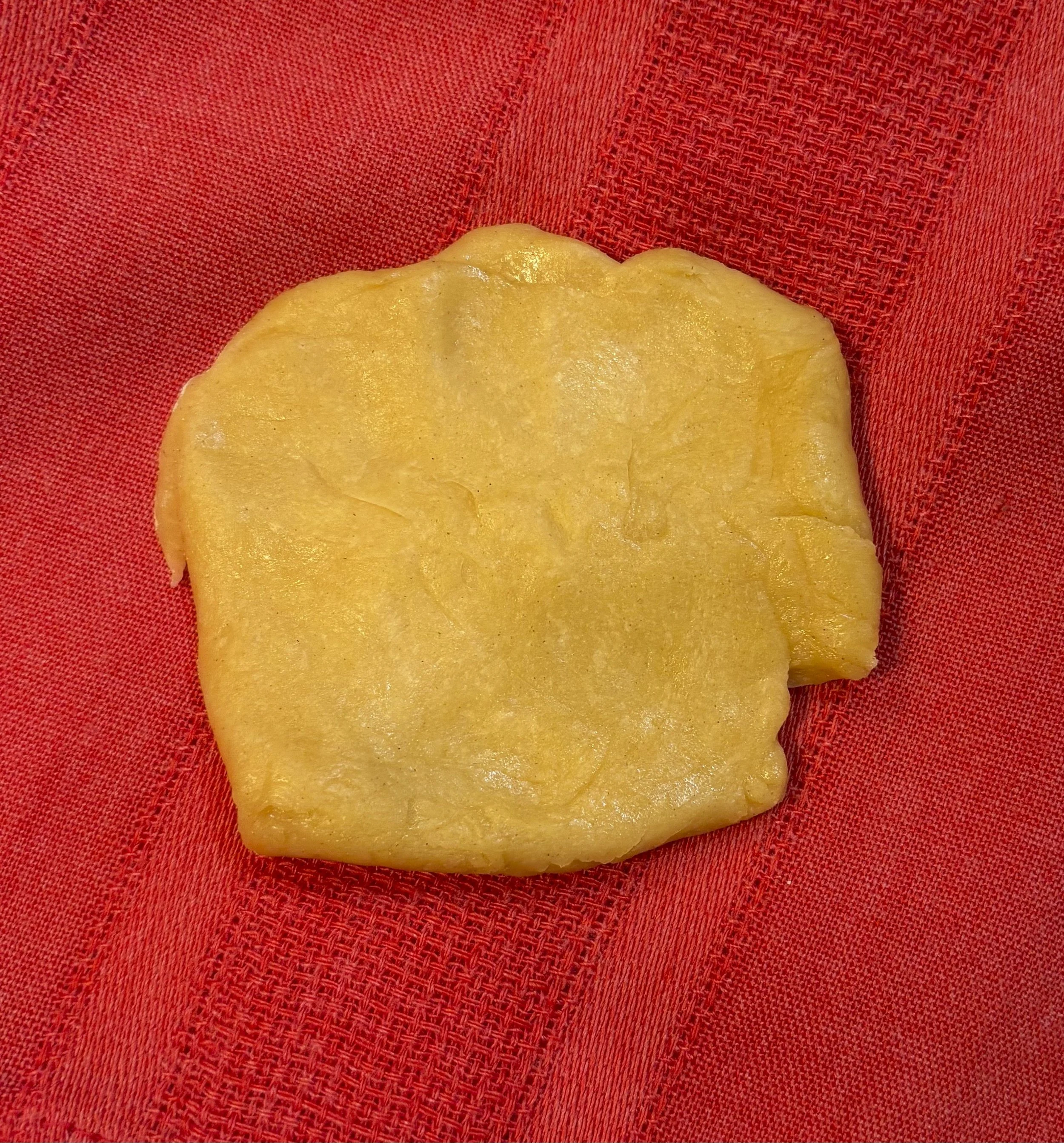 Cut dough into palm-sized pieces