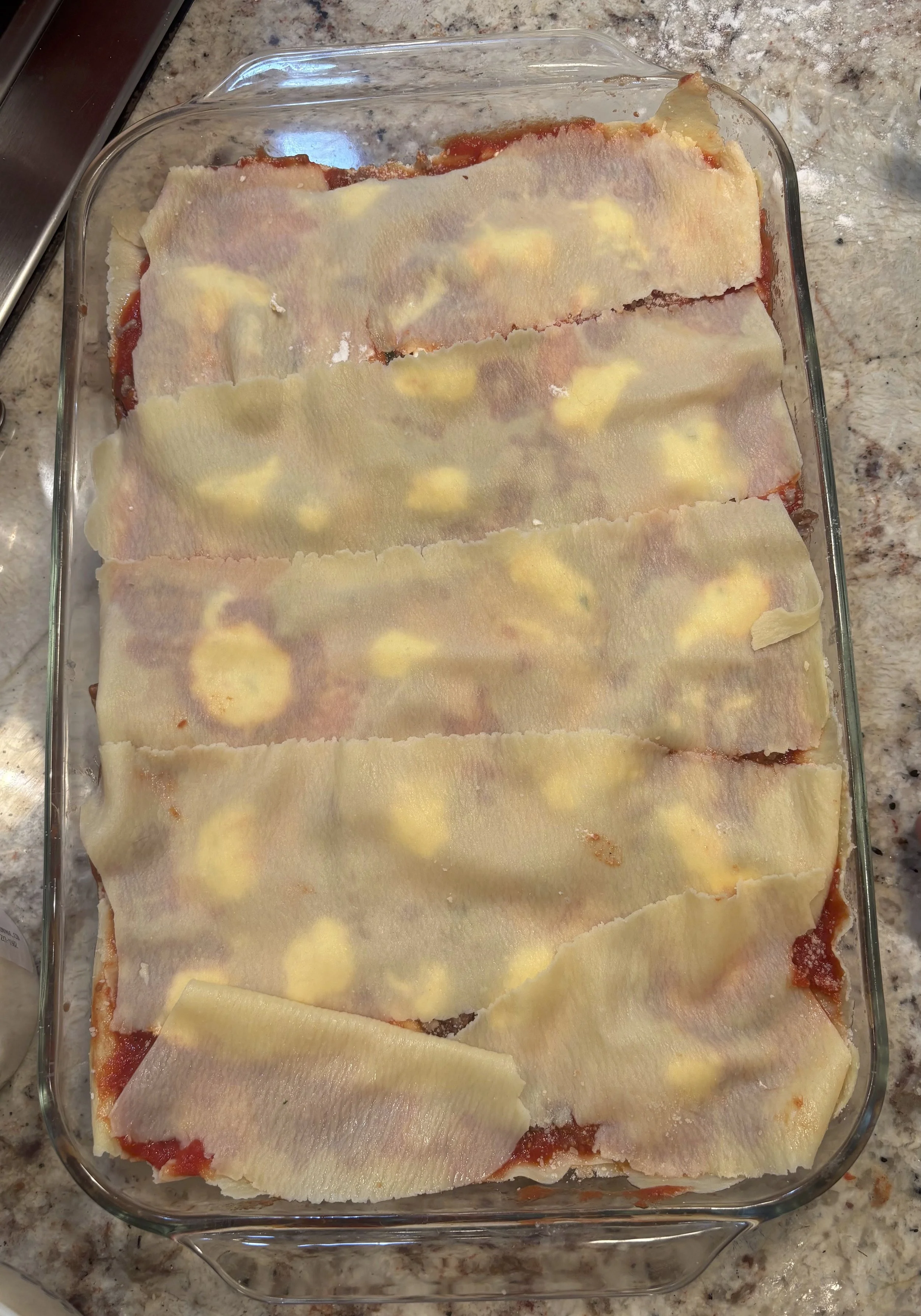 Next layer of pasta.  Criss Cross pattern to preserve structural integrity